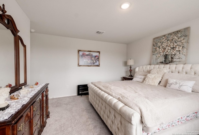 bedroom with light carpet