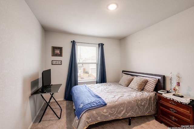 bedroom featuring light colored carpet