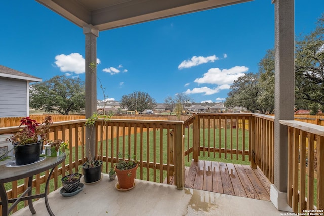 wooden terrace with a yard