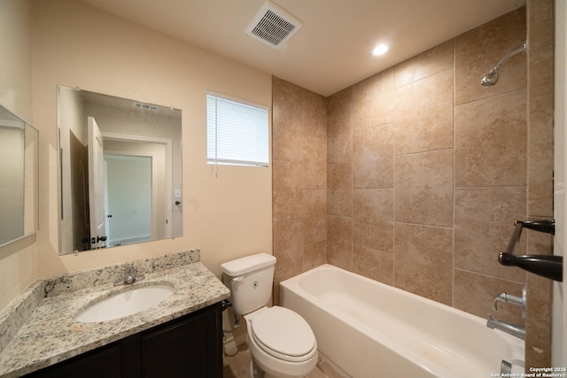 full bathroom with vanity, toilet, and tiled shower / bath combo