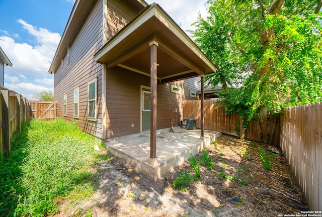 back of house with a patio and central air condition unit