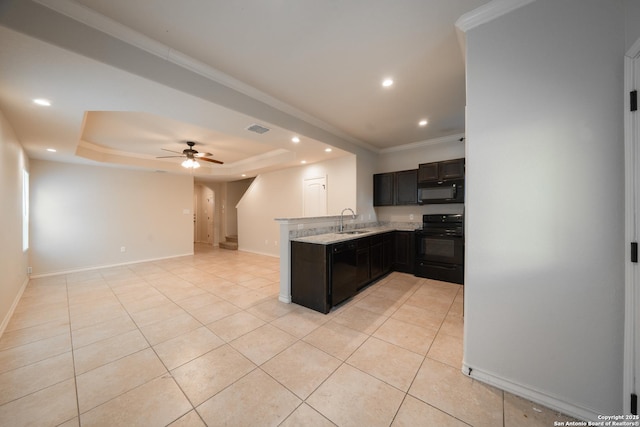 kitchen with a raised ceiling, light tile patterned flooring, sink, and black appliances