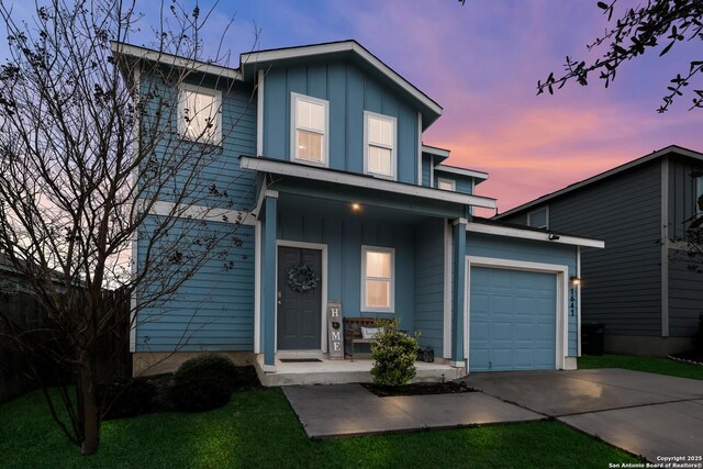 view of front property with a garage and covered porch