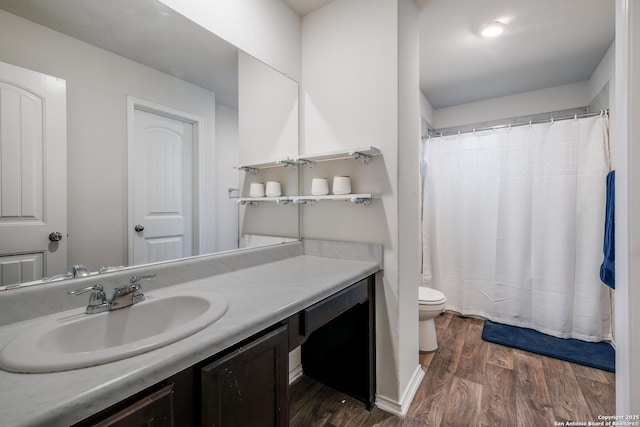 bathroom featuring vanity, a shower with curtain, wood-type flooring, and toilet