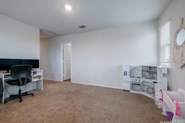 carpeted office featuring sink