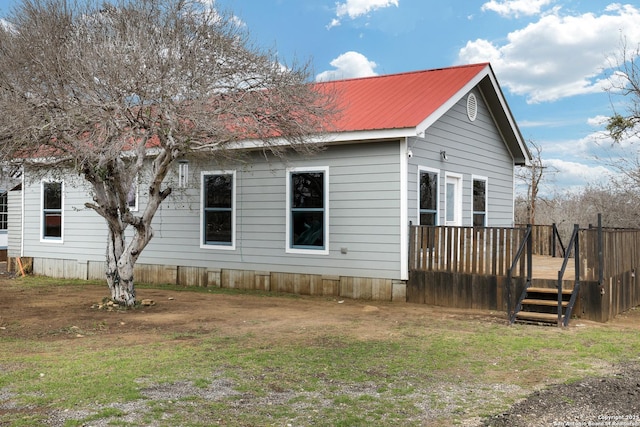 view of side of home featuring a deck