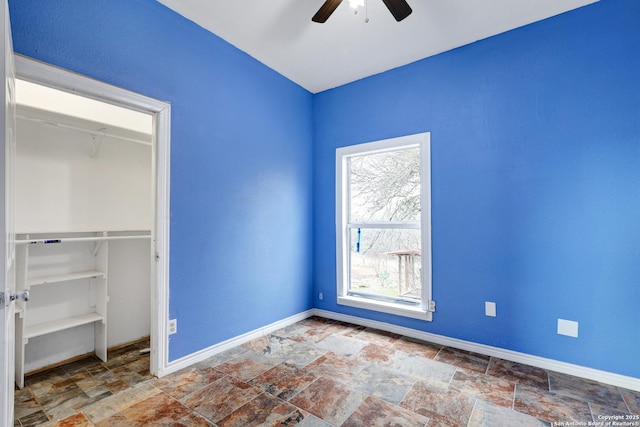unfurnished bedroom featuring a closet and ceiling fan