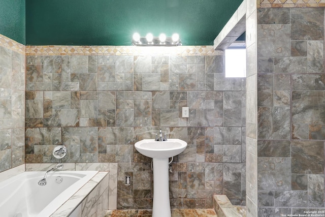 bathroom featuring a tub and tile walls