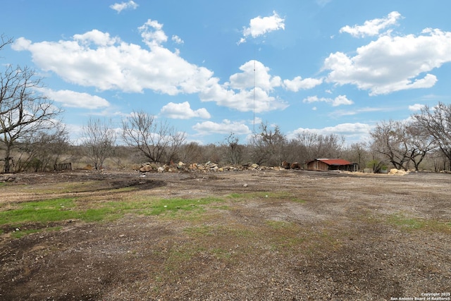 view of yard with a rural view