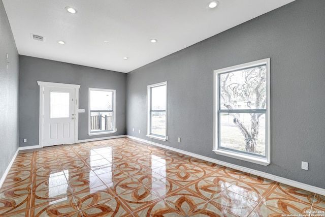 unfurnished room with light tile patterned floors