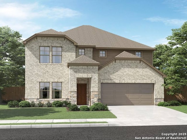 view of front facade featuring a garage and a front yard