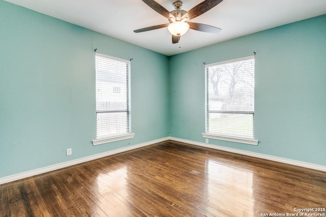 spare room featuring hardwood / wood-style flooring and ceiling fan