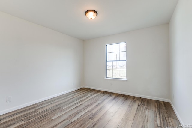 spare room with light wood-type flooring