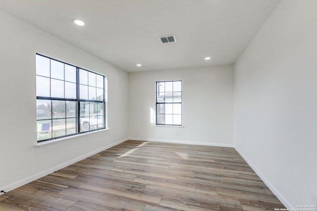 unfurnished room featuring light wood-type flooring