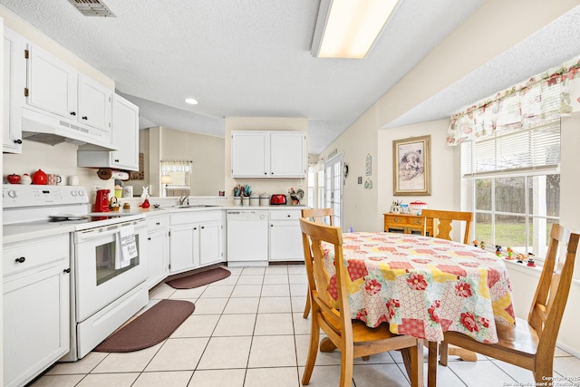 kitchen featuring white cabinetry, sink, and white appliances