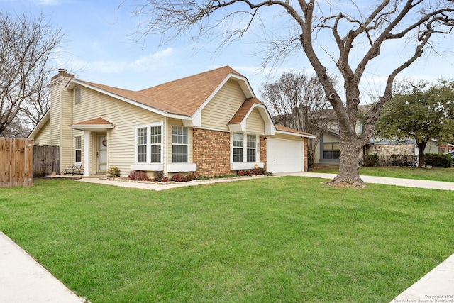 view of front of property with a garage and a front lawn