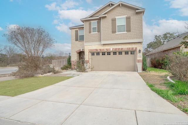 view of front of property featuring a garage and a front yard