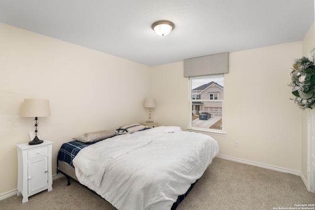 bedroom with light carpet