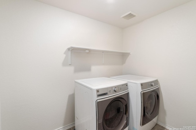 laundry area with separate washer and dryer