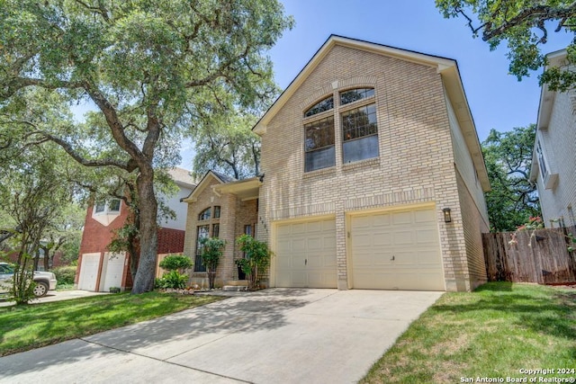 view of front facade with a garage and a front yard