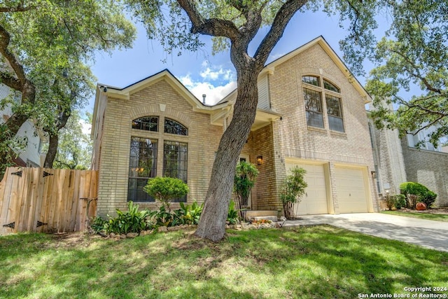 view of front facade featuring a garage and a front lawn