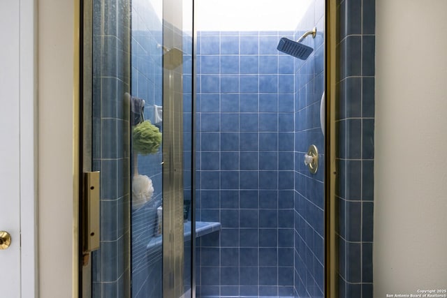 bathroom with tiled shower