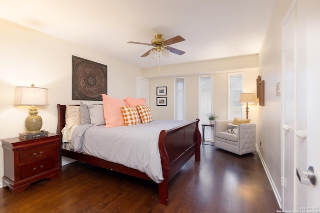 bedroom featuring dark hardwood / wood-style flooring and ceiling fan