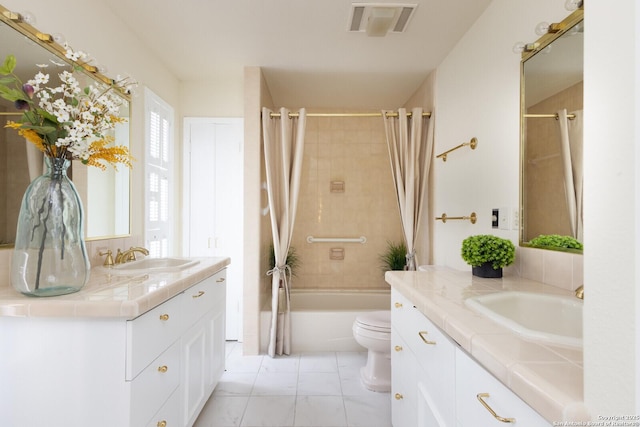 full bathroom featuring vanity, toilet, and shower / bath combo with shower curtain