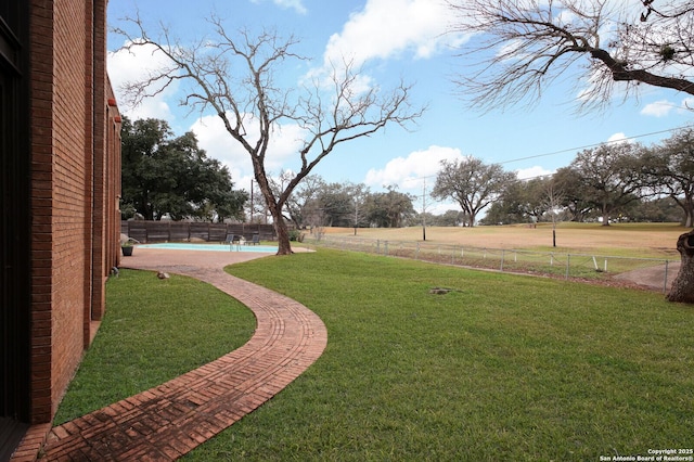 view of yard featuring a fenced in pool