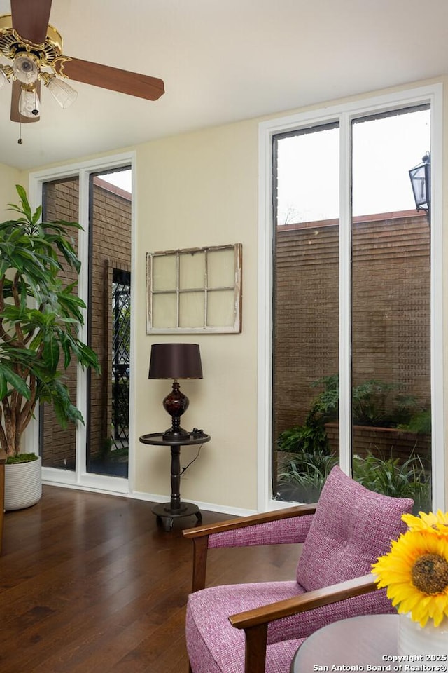 interior space with floor to ceiling windows and dark hardwood / wood-style floors