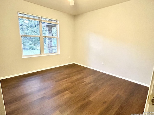 spare room with ceiling fan and hardwood / wood-style floors