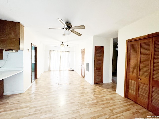 interior space with ceiling fan and light wood-type flooring