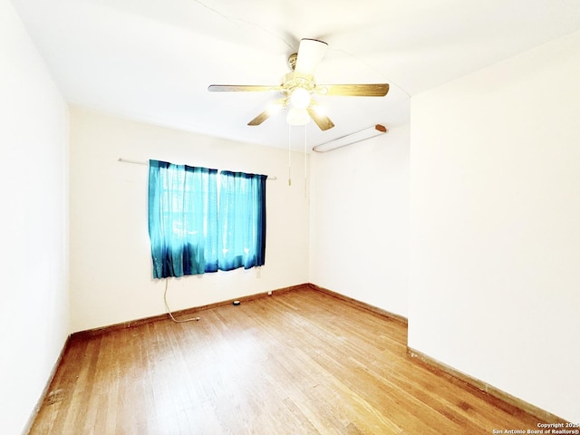 unfurnished room featuring ceiling fan and wood-type flooring