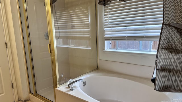 10308 Bobcat Blf, San Antonio, TX 78251 - bathroom with a stall shower and a bath