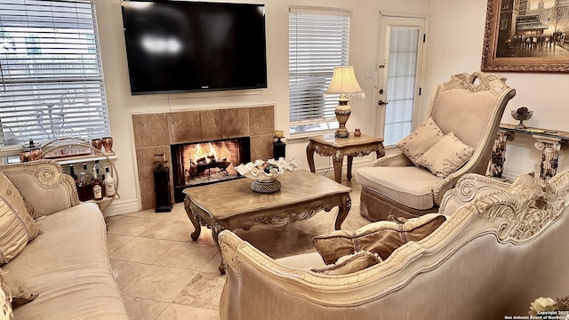 tiled living room featuring a tile fireplace