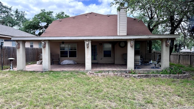 10308 Bobcat Blf, San Antonio, TX 78251 - rear view of property with a chimney and a patio