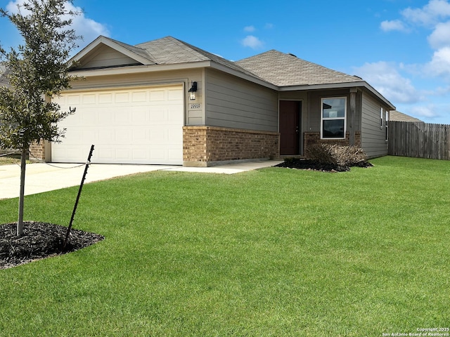 ranch-style home with a garage and a front lawn