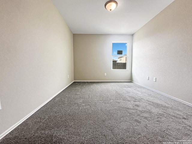 unfurnished room featuring carpet