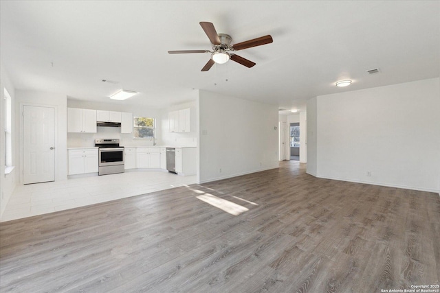 unfurnished living room with light hardwood / wood-style floors and ceiling fan