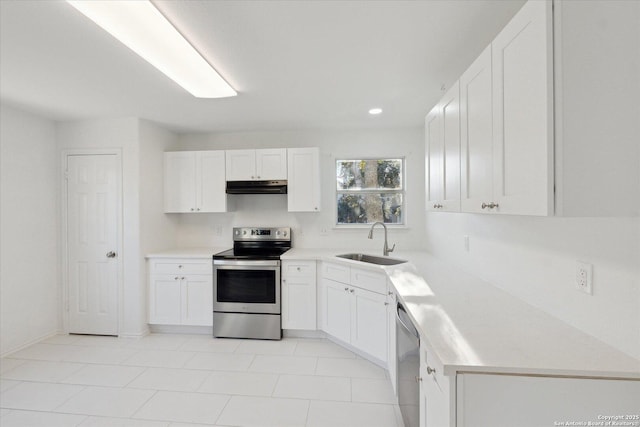 kitchen featuring stainless steel appliances, sink, and white cabinets