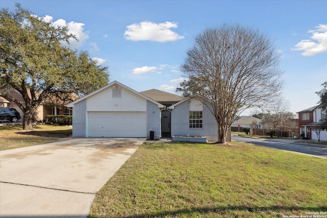 ranch-style house featuring a garage and a front lawn