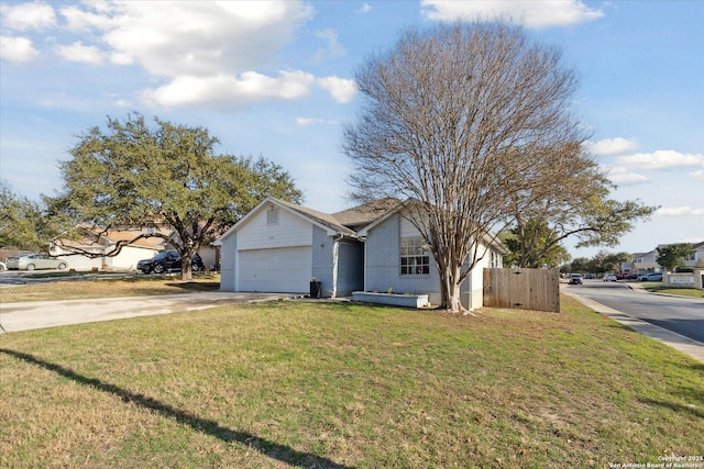 view of front of property with a garage and a front lawn