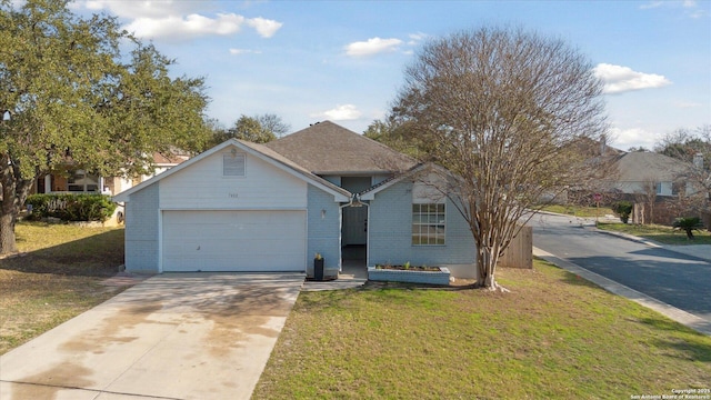 view of front of property featuring a garage and a front yard