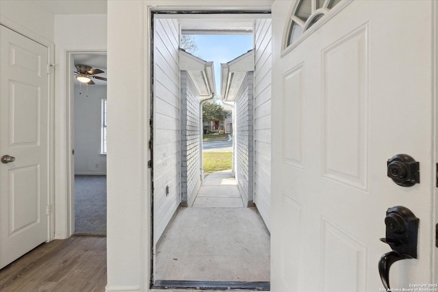 corridor with light hardwood / wood-style flooring