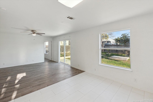 unfurnished room featuring ceiling fan and light hardwood / wood-style flooring