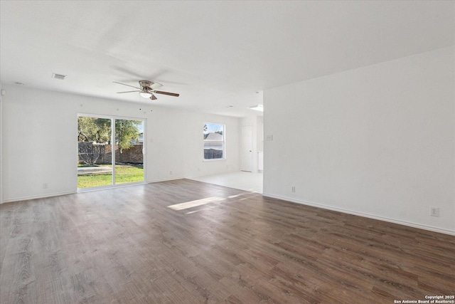 spare room featuring ceiling fan and hardwood / wood-style floors