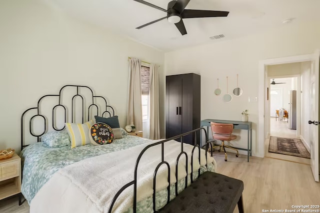 bedroom featuring light hardwood / wood-style flooring and ceiling fan