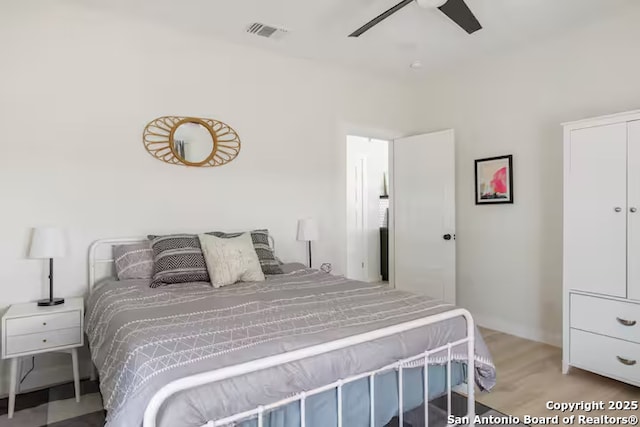 bedroom featuring ceiling fan and light hardwood / wood-style flooring