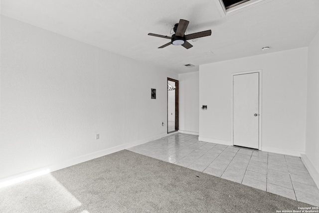 carpeted empty room with ceiling fan