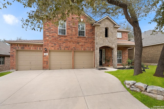 front of property featuring a garage and a front yard